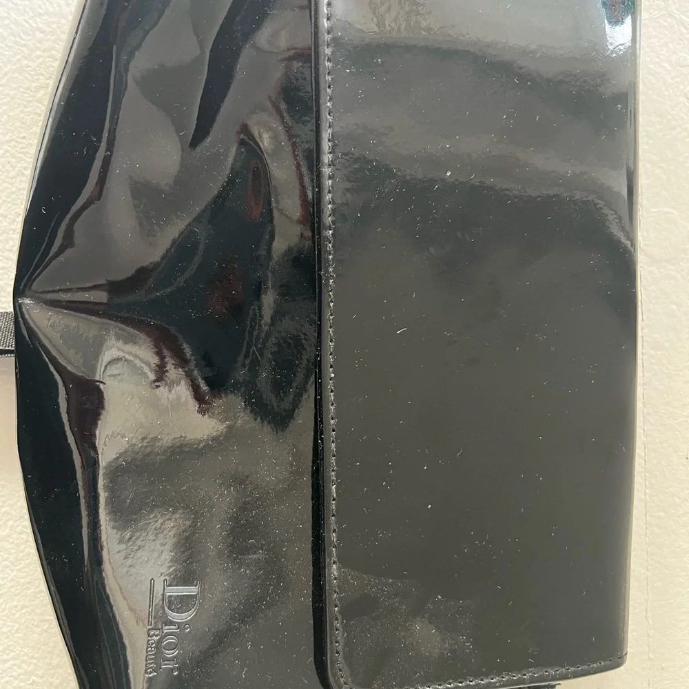 Dior Glossy Black Makeup Bag with Ribbon Detail.